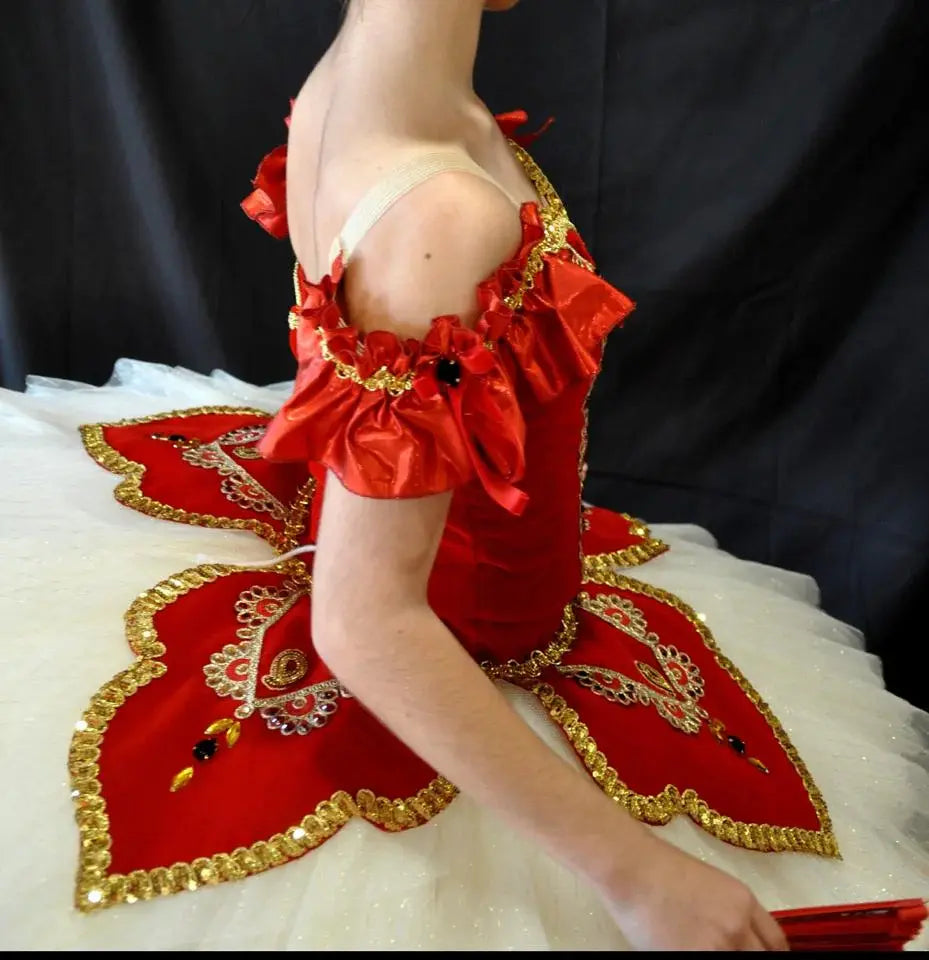 girl wearing paquita red tutu