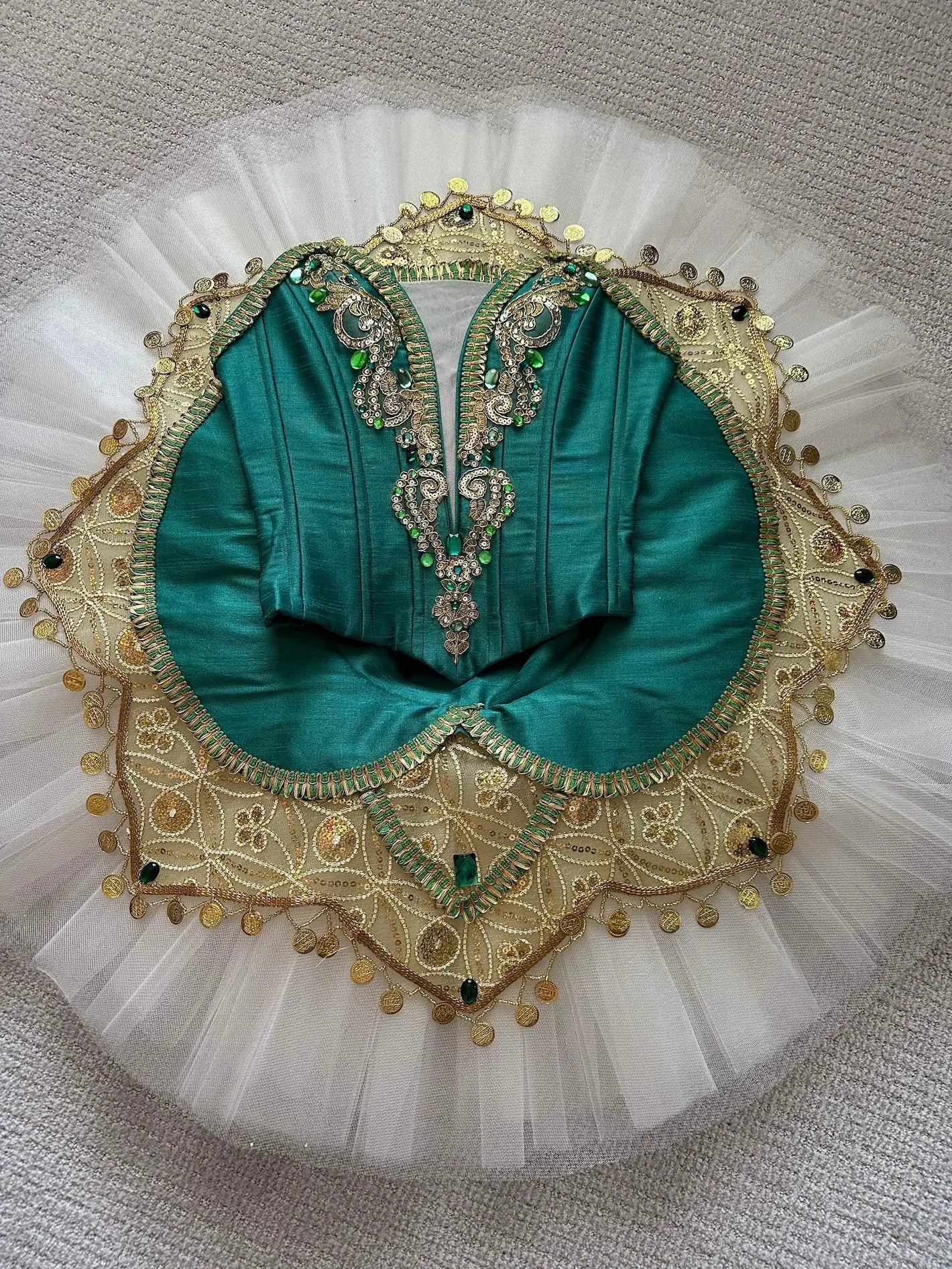 emerald and gold tutu in exhibition