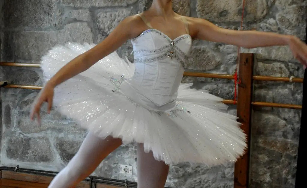 girl wearing white tutu with hoop