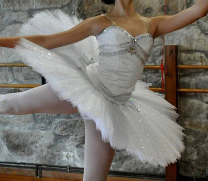 girl standing with white tutu with hoop