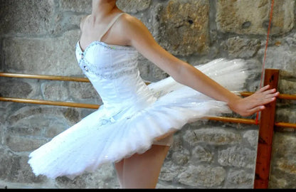 girl posing with white tutu with a hoop