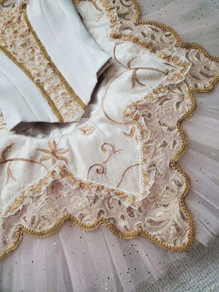 gold details in white tutu