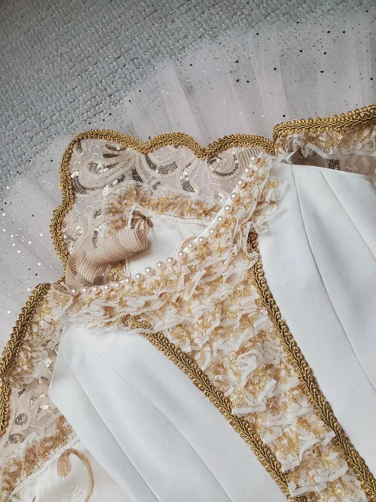 pearls and gold details on white top tutu